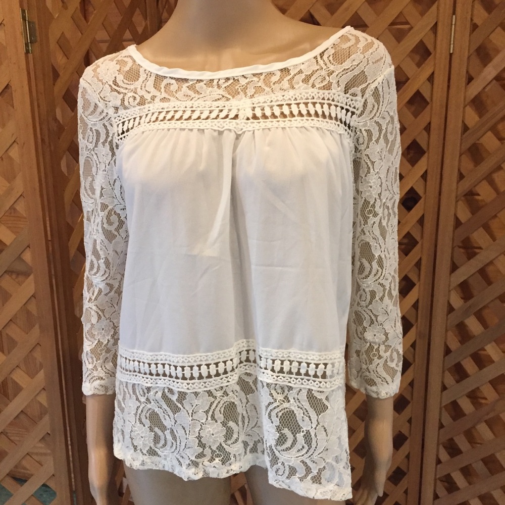 Beautiful, open back lacey blouse